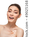 girl with sun drawing on forehead is 49025168