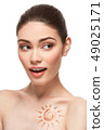 girl with sun drawing on forehead iso 49025171