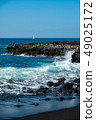 beautiful view on ocean water and black lava sand 49025172