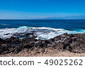 beautiful view on ocean water and black lava sand 49025262