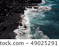 beautiful view on ocean water and black lava sand 49025291