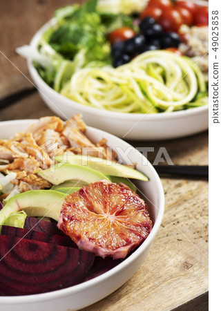 buddha bowl salads on a wooden table buddha bowl salads on a wooden table 49025858