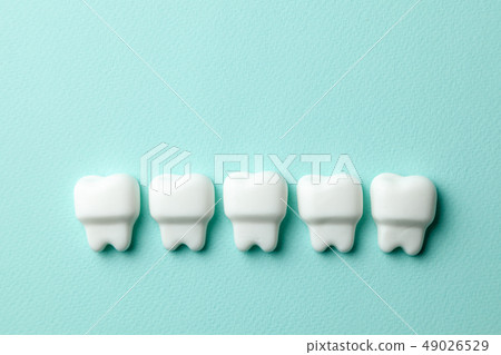 Healthy white teeth on green mint background Healthy white teeth on green mint background 49026529