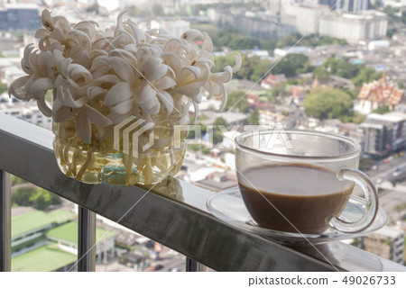 Coffee and flowers at the balcony Coffee and flowers at the balcony 49026733
