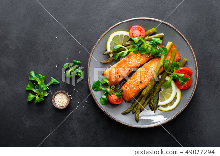 Grilled salmon fish steak, asparagus, tomato and 49027294