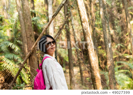 traveling woman walk in forest traveling woman walk in forest 49027399