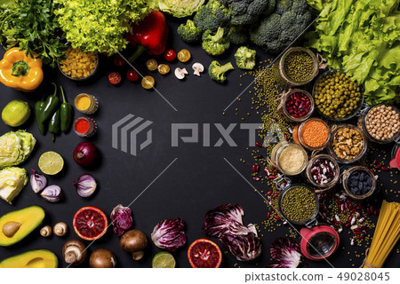 Trend set of fresh vegetables and fruits on black background. Different colorful fresh vegan food 49028045