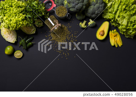 Healthy vegetables and fruits on black background. Detox diet. Different colorful fresh vegan food 49028056