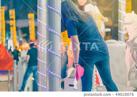 People take a photo  on the children's carousel 49028078