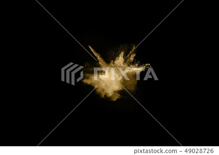 Golden powder explosion on black background. Golden powder explosion on black background. 49028726