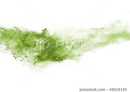 Green powder explosion on white background. 49029185