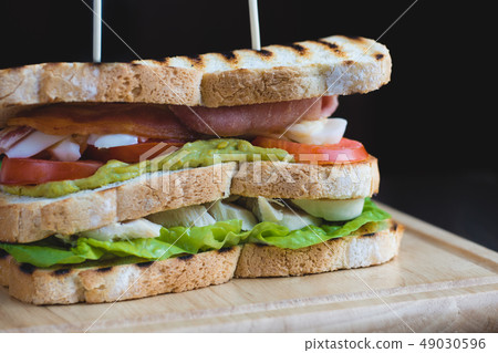Toasted Triple Decker Club Sandwich with chicken, bacon Toasted Triple Decker Club Sandwich with chicken, bacon 49030596