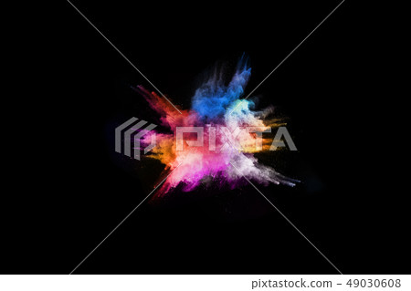 Colored powder on black background.  49030608