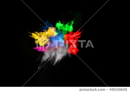 Colored powder on black background.  49030609