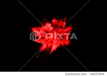 Abstract red powder splatted on black background. Abstract red powder splatted on black background. 49031044