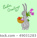 Easter bunny holding a basket with big paschal eggs 49031283