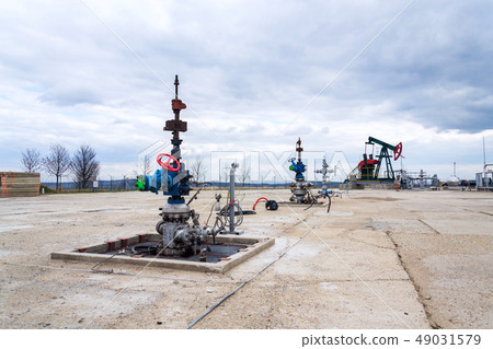 Green and red pumpjack, oil horse, oil derrick Green and red pumpjack, oil horse, oil derrick 49031579