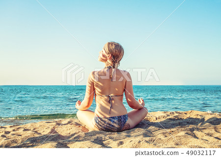 Happy girl relaxing on tropical sea beach Happy girl relaxing on tropical sea beach 49032117