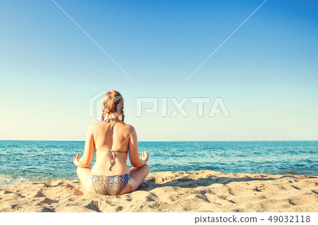 Young girl on sea beach. Vacation and holiday 49032118