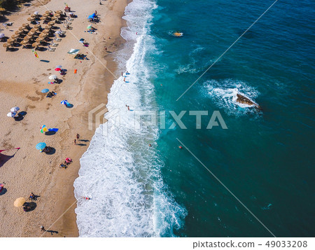 Beach with sun loungers on the coast of the ocean 49033208