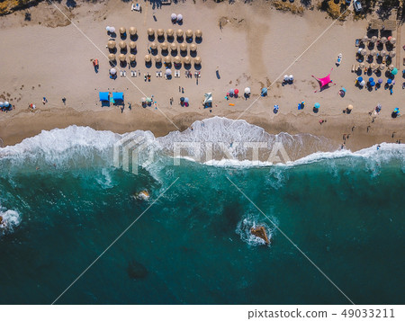 Beach with sun loungers on the coast of the ocean 49033211