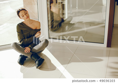 elegant girl in a green blouse elegant girl in a green blouse 49036103