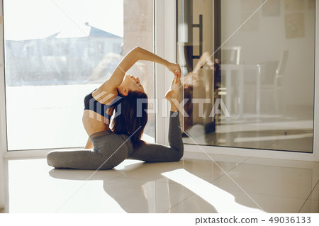 pretty gymnast near windows 49036133