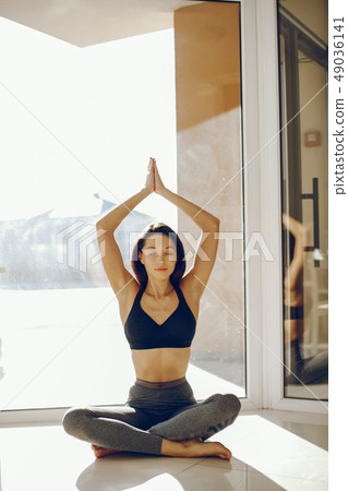 pretty gymnast near windows 49036141