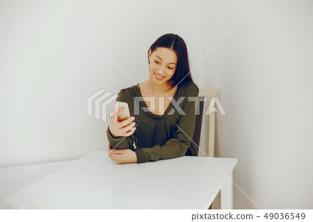 elegant girl in a green blouse elegant girl in a green blouse 49036549