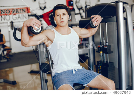 man in a gym man in a gym 49037943
