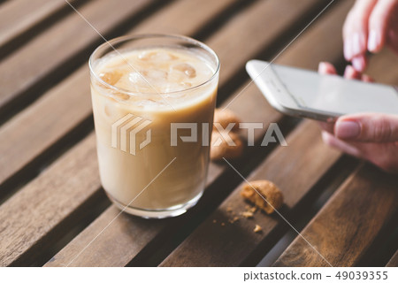 Ice latte, cookies and smartphone 49039355