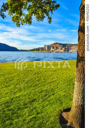 Evening view on center part of Kelowna over Okanagan lake. Evening view on center part of Kelowna over Okanagan lake. 49040203