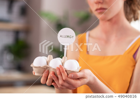 Disconcert skinny girl presenting forbidden allergic eggs Disconcert skinny girl presenting forbidden allergic eggs 49040816