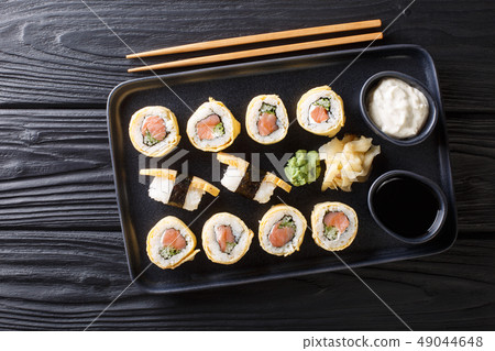 Tamagoyaki sushi roll with rice, cheese, salmon 49044648