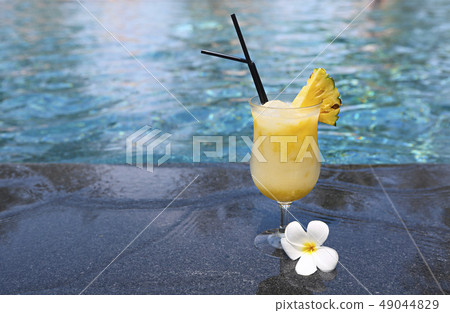 Glass of pinacolada cocktail standing on the 49044829