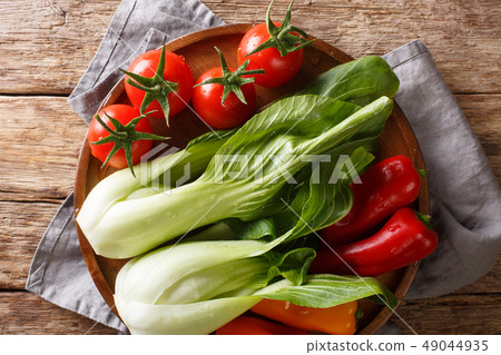 raw healthy baby bok choy, tomatoes and peppers 49044935