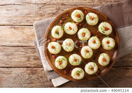 Freshly made potato dumplings with bacon 49045114