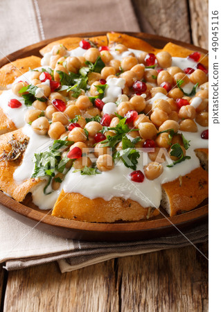 Middle Eastern pita with chickpeas, yogurt 49045116