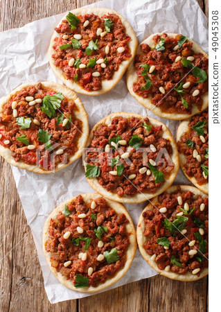 Arab mini pizza with minced meat, tomatoes Arab mini pizza with minced meat, tomatoes 49045308