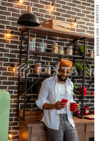 Delighted African American man enjoying his morning 49047333