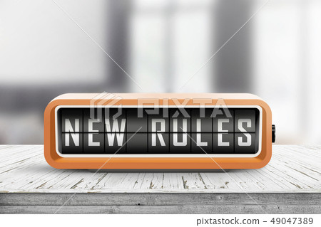 New rules alarm message on a wooden desk New rules alarm message on a wooden desk 49047389