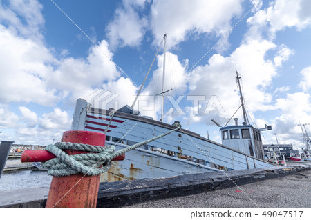 Fishing boat in a Scandinavian harbor in retro Fishing boat in a Scandinavian harbor in retro 49047517