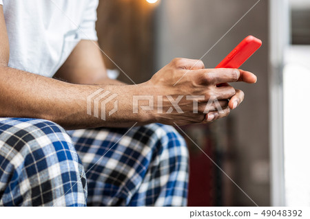 Close up of a modern gadget in male hands 49048392