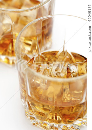 Glasses of scottish whiskey with ice cubes 49049185