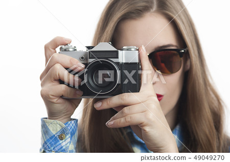 Young charming positive woman photographer with camera 49049270