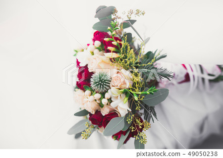 Beautiful wedding bouquet with different flowers, roses Beautiful wedding bouquet with different flowers, roses 49050238
