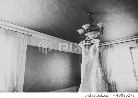 The perfect wedding dress in the room of the bride The perfect wedding dress in the room of the bride 49050272