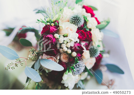 Beautiful wedding bouquet with different flowers, roses Beautiful wedding bouquet with different flowers, roses 49050273