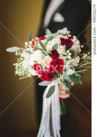 Beautiful wedding bouquet with different flowers, roses Beautiful wedding bouquet with different flowers, roses 49050274