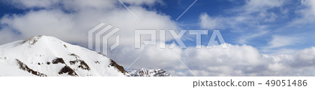 Panorama of snowy mountains and sky with clouds 49051486
